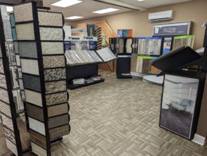 An interior view of the showroom displaying various tile and wood-look flooring options at Petersen's Carpet & Flooring in Frederick, MD