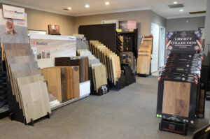 An interior showroom displaying various flooring samples, including carpet, at Floor Concepts in Owensboro, KY.