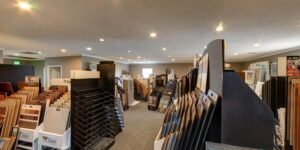 An interior view of the showroom with a carpeted floor and a doorway at Floor Concepts in Owensboro, KY.