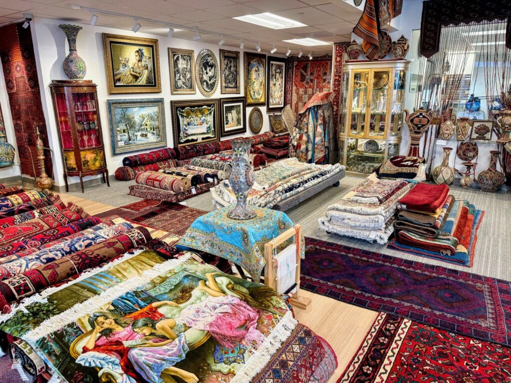 Interior view of the Art Of Persia showroom showcasing a variety of Persian rugs and home decor in Portland, OR.