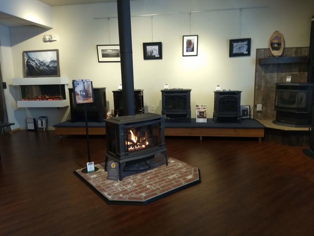 A showroom featuring a variety of wood stoves and fireplaces from Wood Stoves For Sale in Fairbanks, AK.