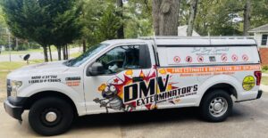 Side view of a branded pest control truck for El Exterminador Del DMV in Rockville, MD, showing service details.