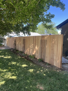 Side yard wood privacy fence installation by Builders choice Fence, Deck & Patio Covers in Nampa, ID