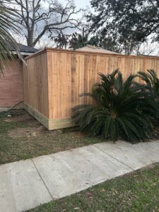 A newly installed wood privacy fence enclosing a side yard area by Wood Fence Houston in Houston, TX.