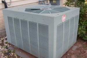A single Rheem outdoor HVAC condenser unit providing cooling for a home, maintained by Spot On HVAC Services in Jackson, MS.