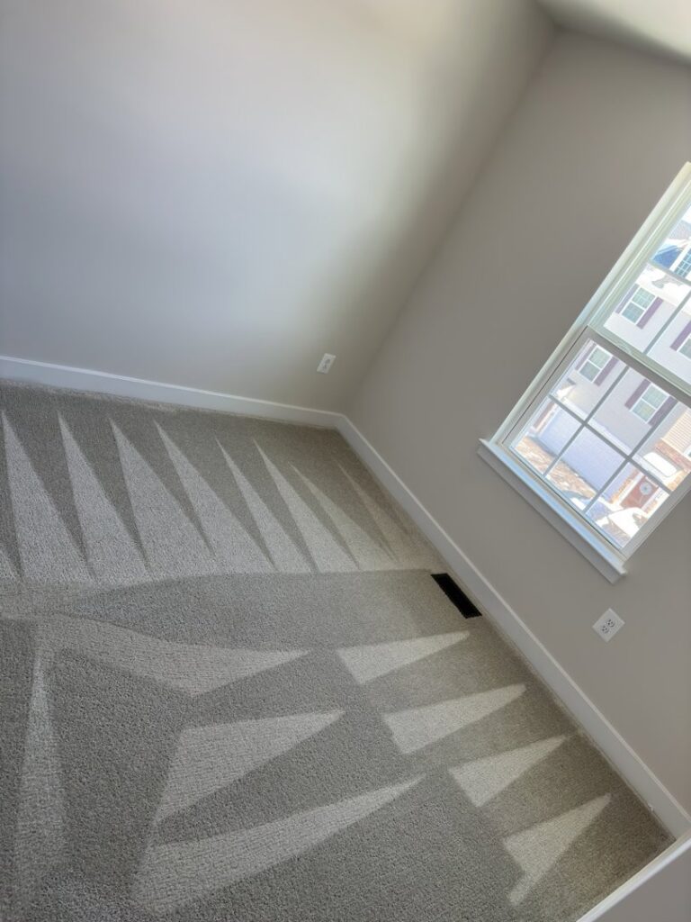A small room with a perfectly cleaned carpet showing fresh patterns by Oxi Fresh Carpet Cleaning in Frederick, MD