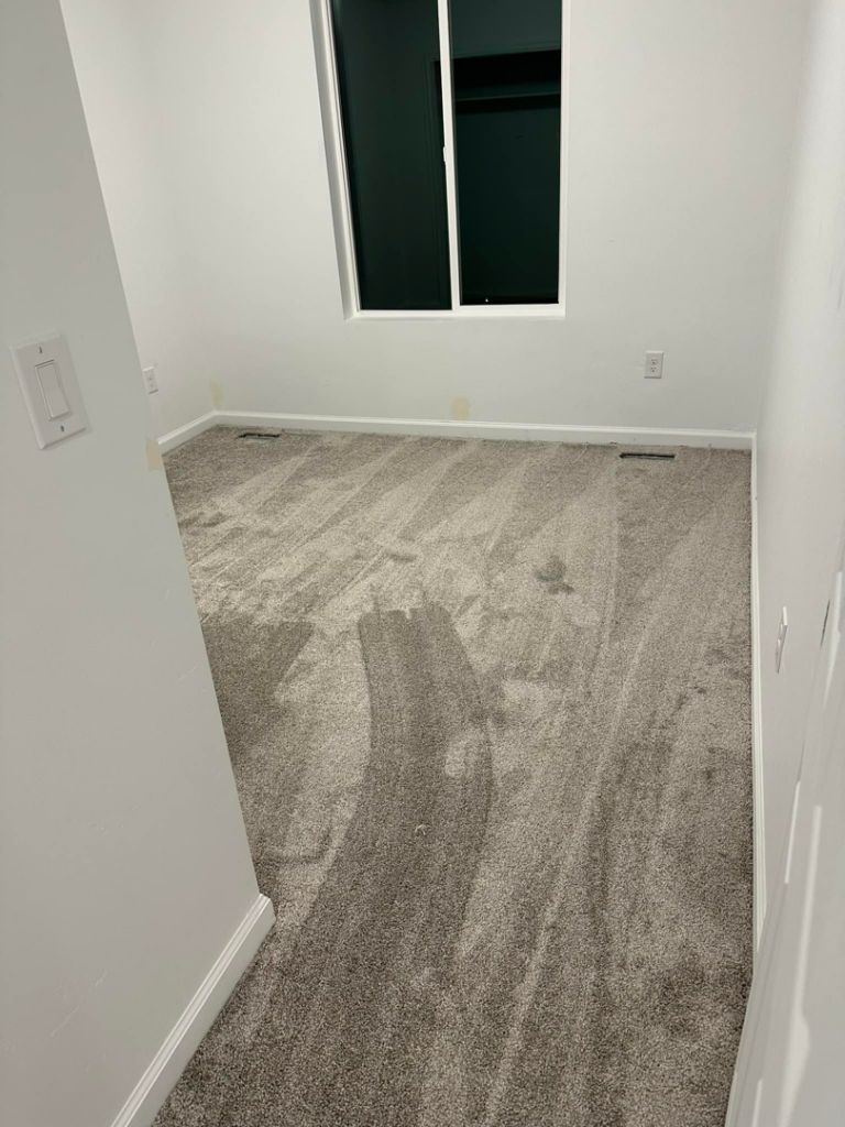 New grey carpet professionally installed in a small room by Millennium Flooring .Co in Salt Lake City, UT.
