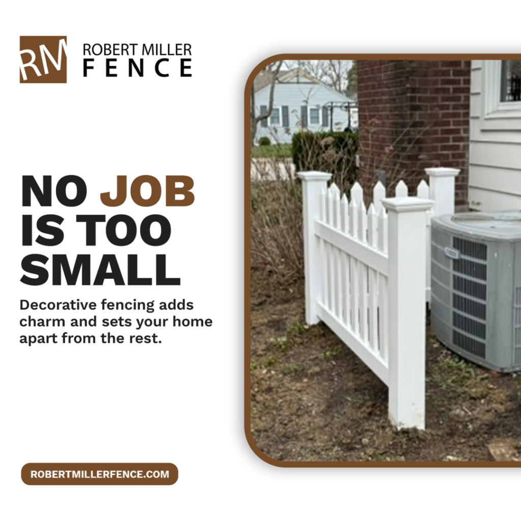 A small section of white picket fence installed next to a house by Robert Miller Fence in Indianapolis, IN.
