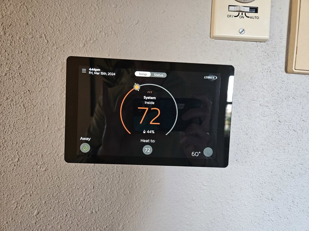 A smart thermostat displaying an indoor temperature of 72 degrees, serviced by All Comfort Services in Madison, WI