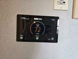A smart thermostat displaying an indoor temperature of 72 degrees, serviced by All Comfort Services in Madison, WI