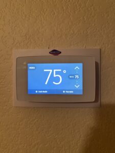 A smart thermostat displaying "Cool Mode" at 75 degrees, installed by Goettl Austin in Austin, TX