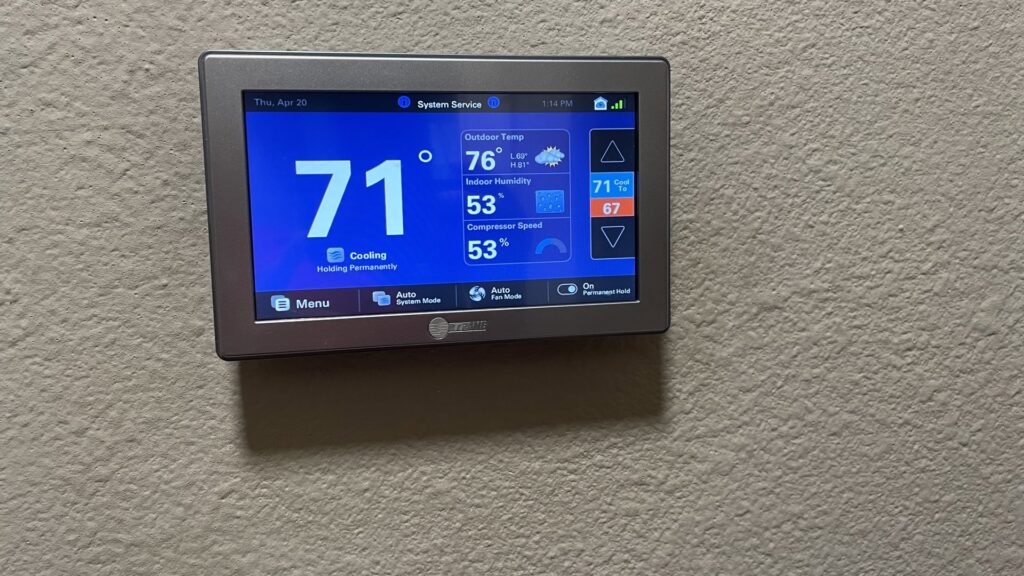 A smart thermostat displaying current temperature and system information, installed by EZ Comfort Air Conditioning & Heating LLC in Humble, TX.