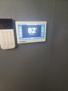 A smart thermostat displaying 82 degrees, installed or serviced by Shrek Heating & Air Conditioning in Toledo, OH.