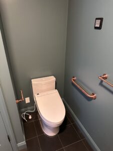 Smart toilet electrical connection and wall control panel installed by Breakers Electric LLC in Dover, NH.