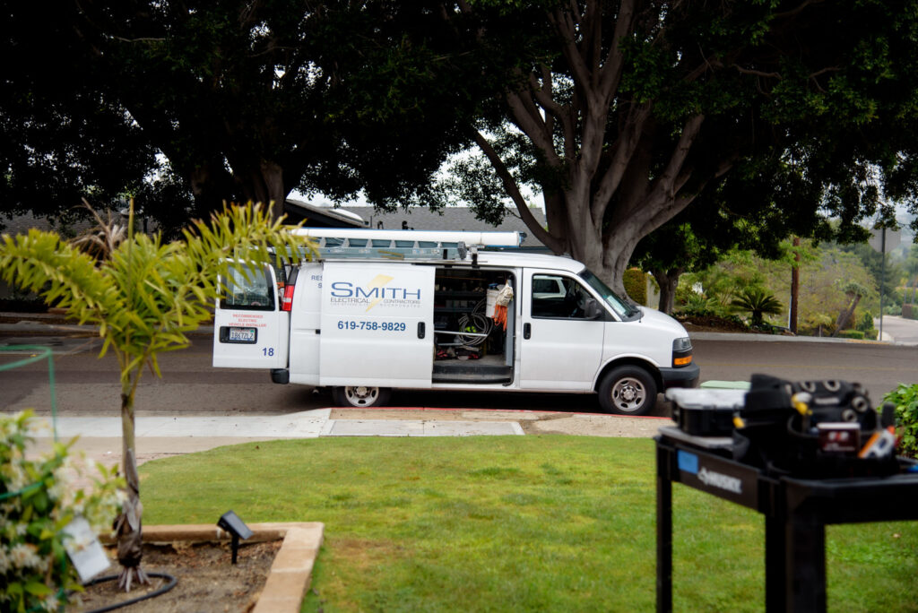 The Smith Electrical Contractors, Inc. service van with its side door open, revealing tools and equipment in El Cajon, CA.