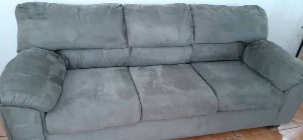 A sofa appearing wet after professional upholstery cleaning by El Paso Carpet Care in El Paso, TX.