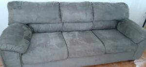 A sofa appearing wet after professional upholstery cleaning by El Paso Carpet Care in El Paso, TX.