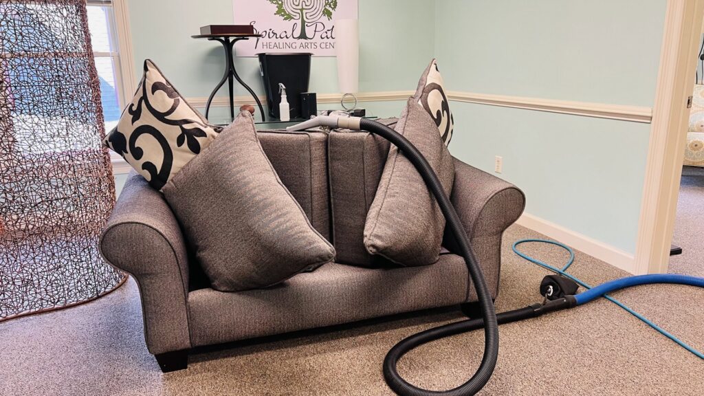 Professional sofa upholstery cleaning in progress with cushions removed by Pronto And Carpet LLC in Charlotte, NC.