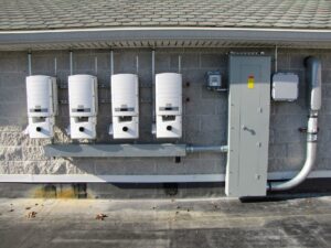 Solar inverters and electrical panel installation on a building by CMI Solar & Electric, Inc. in Newark, DE.