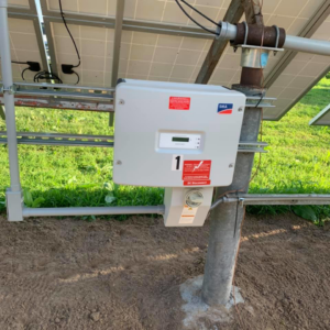 An SMA solar inverter and DC disconnect box installed under solar panels by Affordable Electric, LLC in Kearney, NE.
