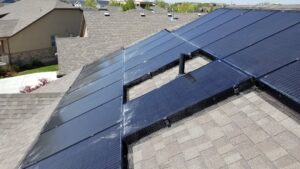 Solar panels on a roof with protective mesh installed for bird and rodent exclusion by Allstate Animal Control in Elizabeth, NJ.