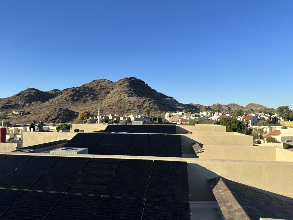 Newly installed solar panels on a large residential or commercial roof by Modern Day Energy in Phoenix, AZ