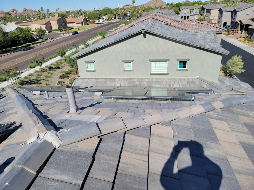 Mesh professionally installed around solar panels on a roof for pigeon exclusion by Pigeon Problem Solvers, LLC in Scottsdale, AZ.