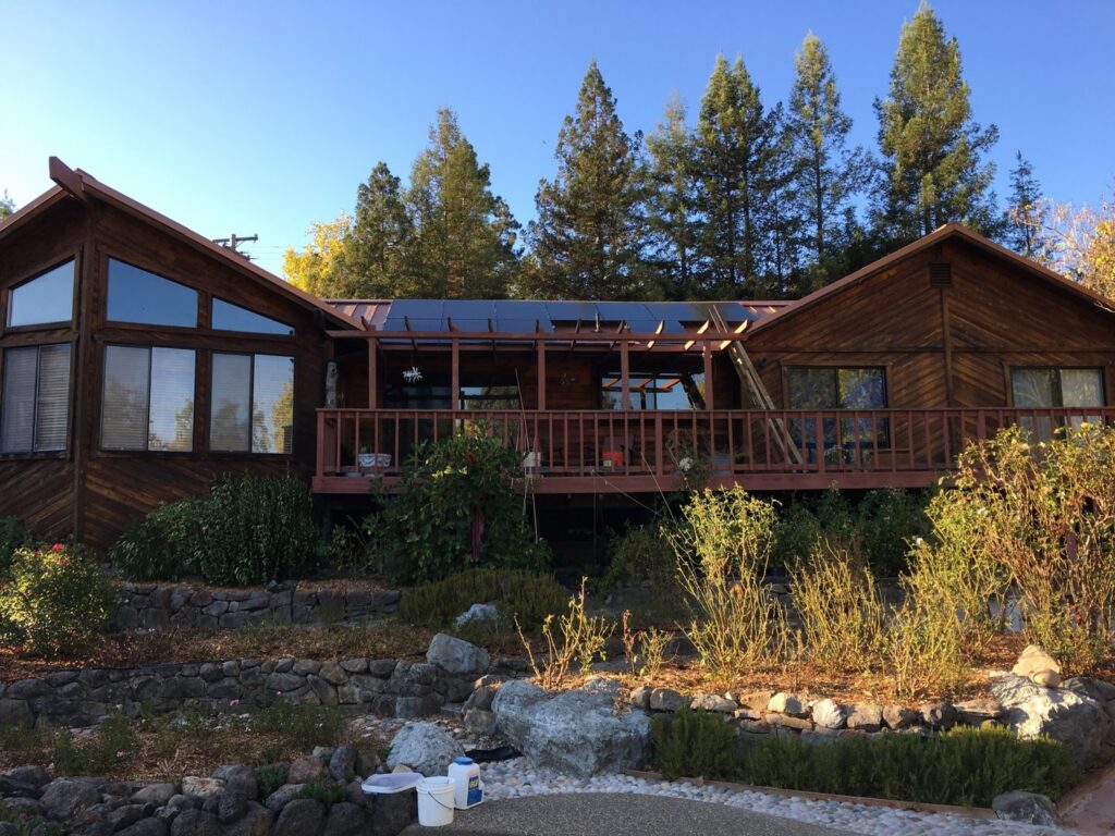Solar panels installed on a flat roof section of a house by Solar & Electric Service Bros in West Sacramento, CA.