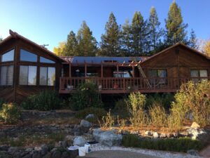 Solar panels installed on a flat roof section of a house by Solar & Electric Service Bros in West Sacramento, CA.