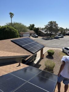 Solar panels installed on a residential house roof and over a carport by Modern Day Energy in Phoenix, AZ