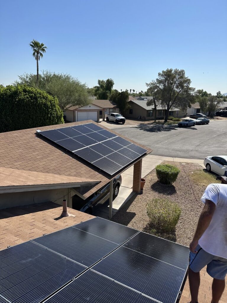 Solar panels installed on a residential house roof and over a carport by Modern Day Energy in Phoenix, AZ