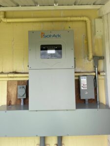 Solar power system components including inverter and electrical conduit installed by Big Island Electric & Solar in Hilo, HI