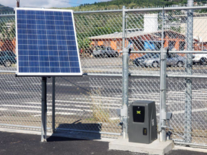 A solar-powered automatic chain-link gate installed by Allied Security Fence in Kapolei, HI