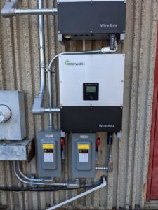 A solar PV inverter and electrical boxes installed by Bright Electric in Evansville, IN.