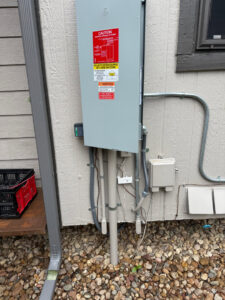 An outdoor electrical panel for a solar PV system installation by Next Level Pros in Lakewood, CO.