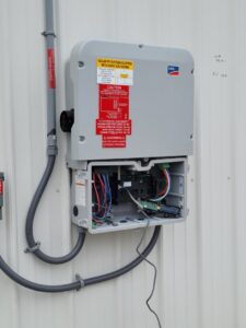 A solar PV system inverter and wiring installed by FOXX & Hounds Electric in Sioux City, IA.
