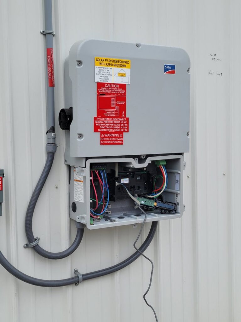 A solar PV system inverter and wiring installed by FOXX & Hounds Electric in Sioux City, IA.