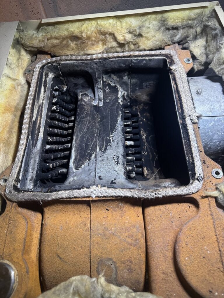 A sooty furnace heat exchanger requiring cleaning or maintenance by Leffler Energy in Lancaster, PA.