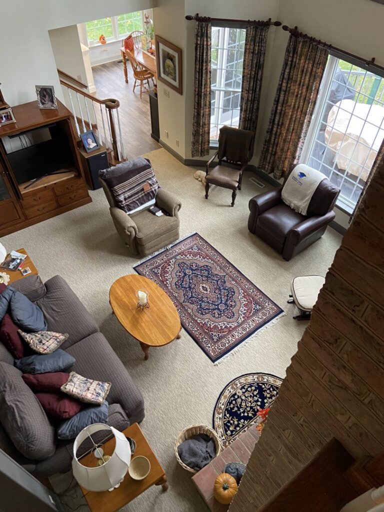 A spacious living room with a new wall-to-wall carpet installation by Burkholder's Flooring America in Hagerstown, MD.