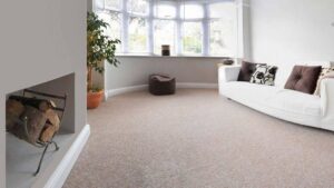 A spacious living room with new beige carpet installed by Carpet King and Flooring in Myrtle Beach, SC.