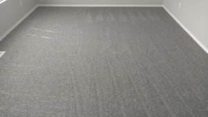 Spacious room with new grey carpet installation by George Babb Floor Covering in Enumclaw, WA.