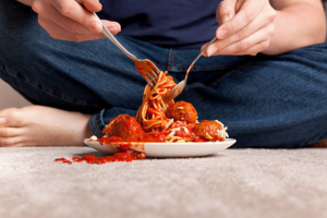 A large spaghetti and meatballs stain on a carpet, requiring expert cleaning from Rocky Mountain Dry Carpet Cleaning in Colorado Springs, CO.