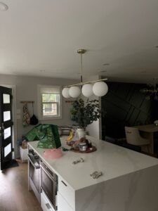 Spherical pendant lights and recessed lighting installed in a kitchen by Armenergo Electrician in Rockville, MD