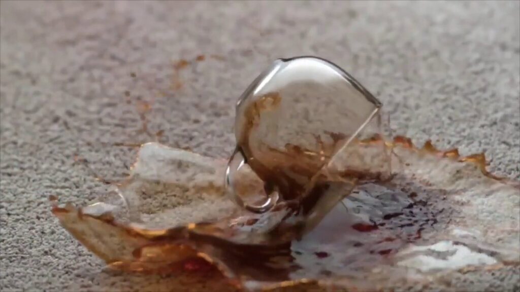 A spilled coffee cup on a carpet, illustrating a common stain problem that North County Carpet Cleaning in Vancouver, WA can fix