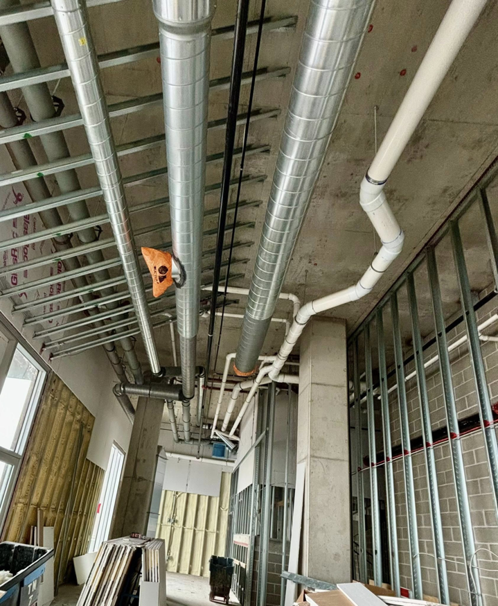 Spiral ductwork installation in a commercial building by Sheet Metal Solutions, LLC in Duluth, MN.