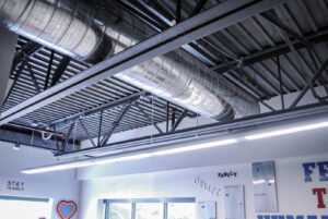 Exposed spiral HVAC ductwork and structural elements in a commercial ceiling, installed by Air-Flow Mechanical Services, Inc. in Cincinnati, OH.