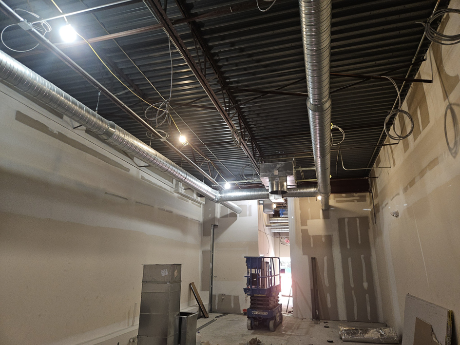 Installation of spiral HVAC ductwork in a commercial building by Acclimated Air LLC in Virginia Beach, VA.