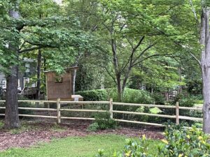 A rustic split-rail fence with wire mesh for added security by Superior Fence & Rail of Charlotte, NC