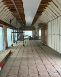 Spray foam insulation applied to attic walls and ceiling by Liquid Green Spray Foam Insulation in Brewster, NY