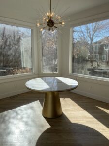 A modern sputnik chandelier installed in a dining area by All Electric llc in Denver, CO
